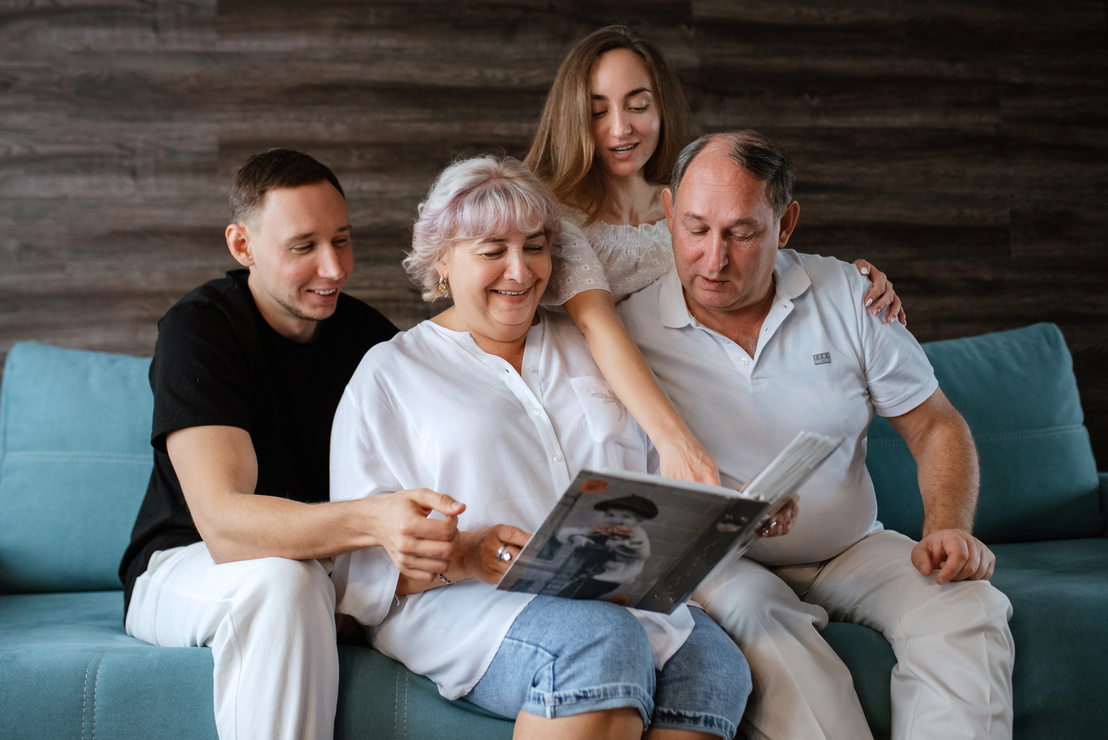 family looking at family photo album