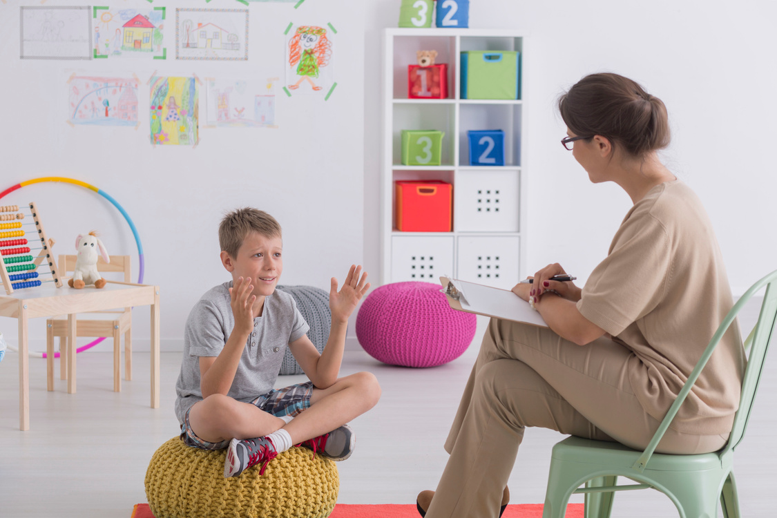 Child talking to therapist